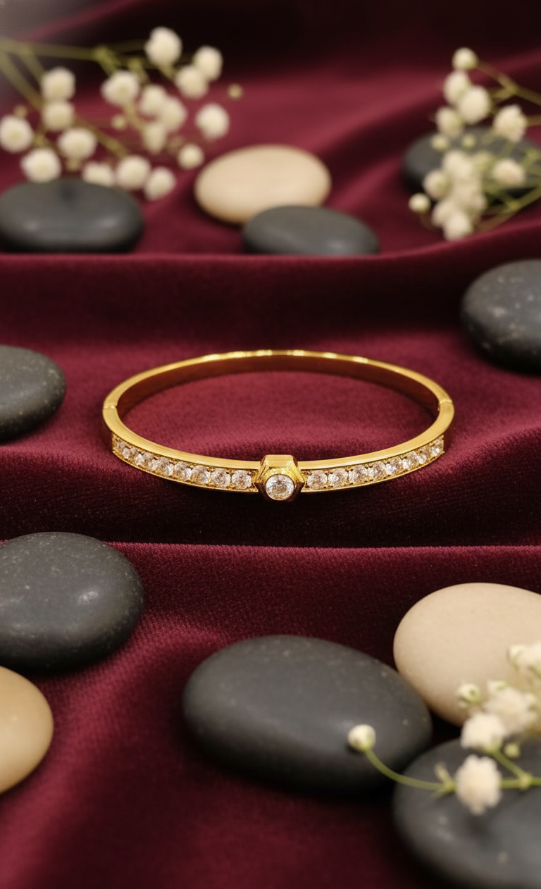 Gold Bangle with Central Solitaire and Pave Accents