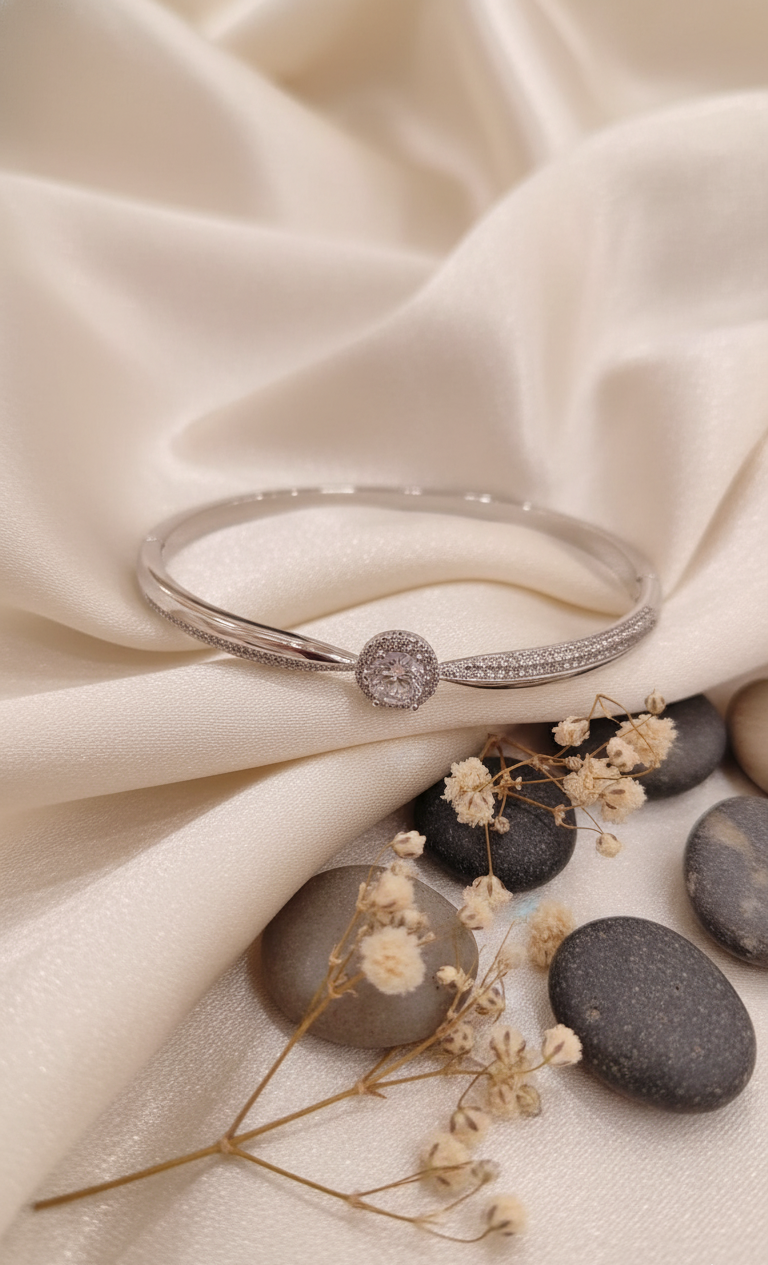 Dazzling Silver-Tone Oval Solitaire Bangle