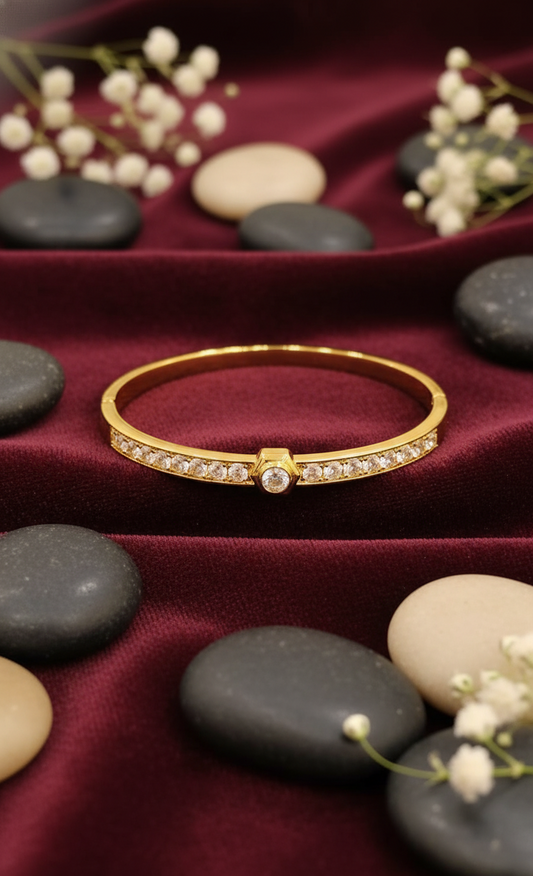 Gold Bangle with Central Solitaire and Pave Accents