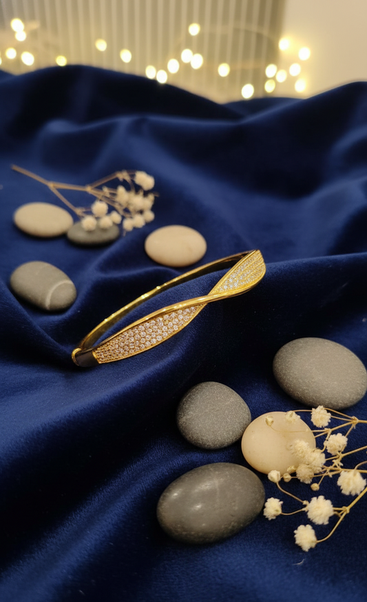 Elegant Twisted Gold Bangle with Pave Accents