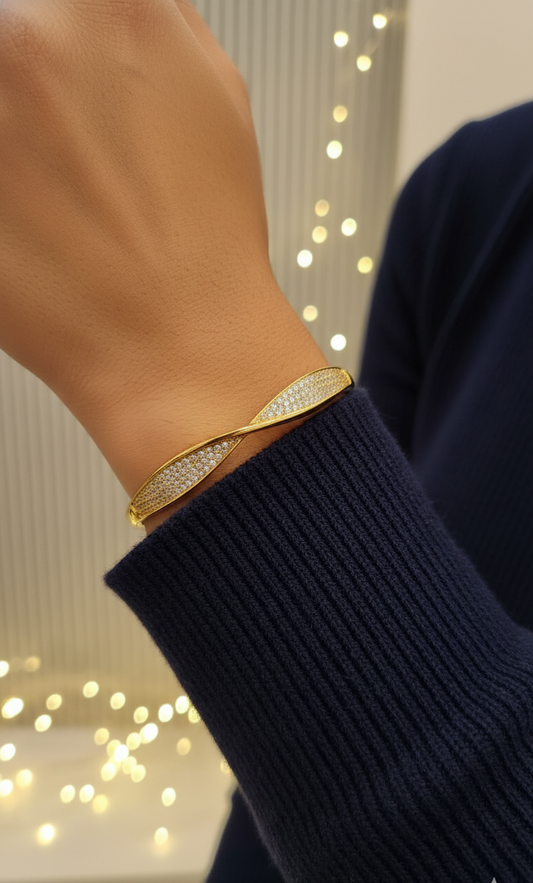 Elegant Twisted Gold Bangle with Pave Accents